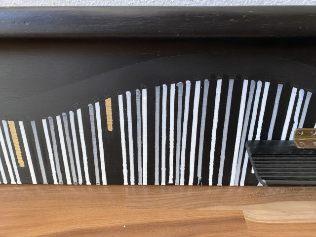 this is an old piano cover from a Manegold piano painted in commission for a client. Unique and vibrant artwork in black, white and golden by german woman artist Astrid Stoeppel